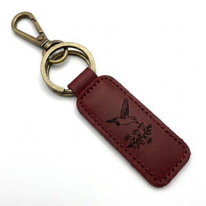 Burgundy leather hummingbird keychain with a brass lobster clasp and key ring