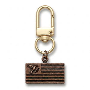 Copper USA flag charm with a hummingbird, on a gold swivel clasp