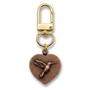 Copper heart charm with a hummingbird, on a gold swivel clasp