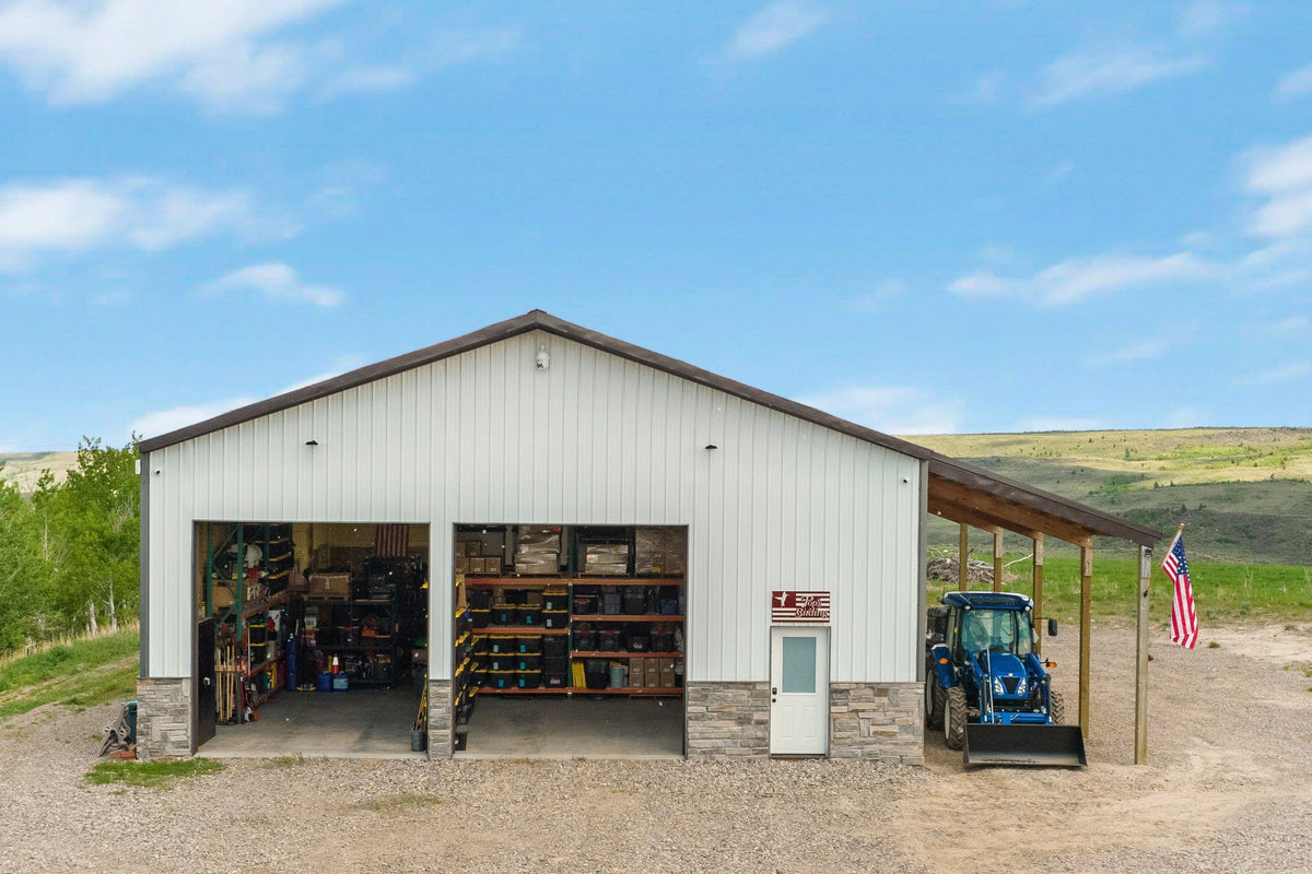 Pop's Birding's Idaho shop with its Pop's Birding sign, an American flag, aspen trees and open hills