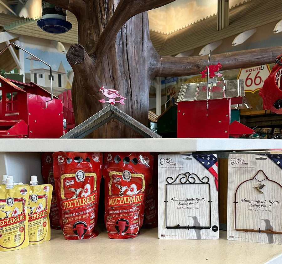 Pop's Nectarade® nectar and Pop's hummingbird swings on a retail store shelf